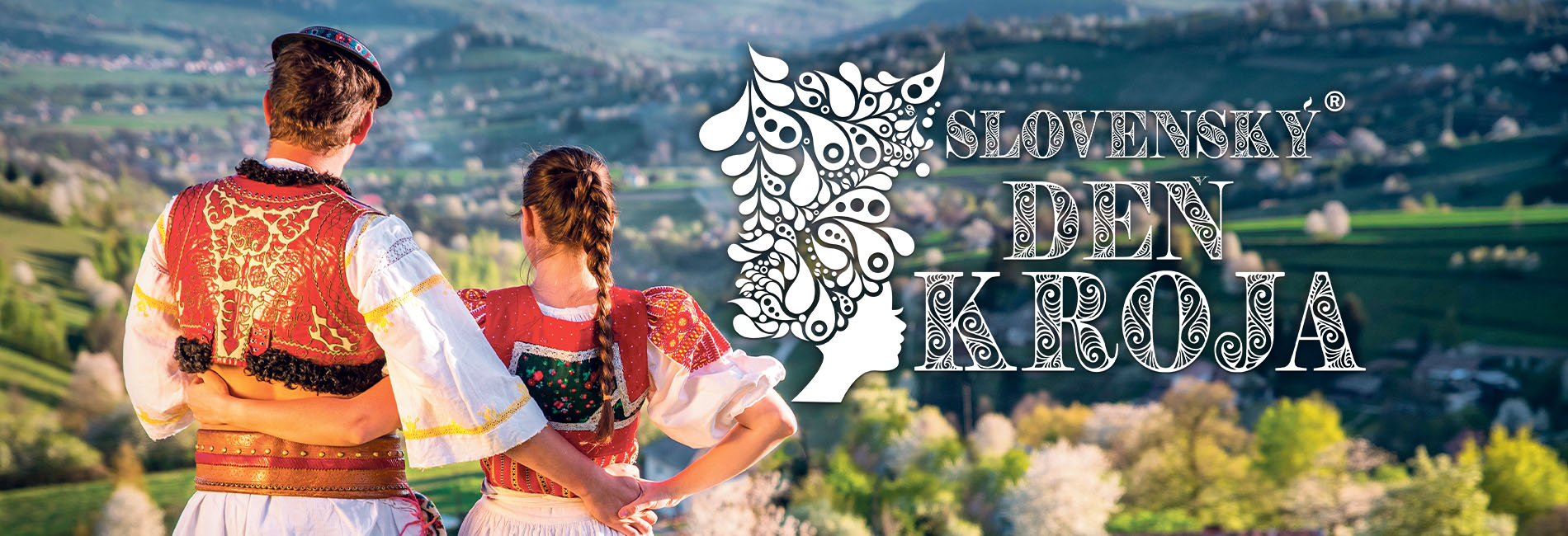 muž a žena v kroji, otočení chrbtom